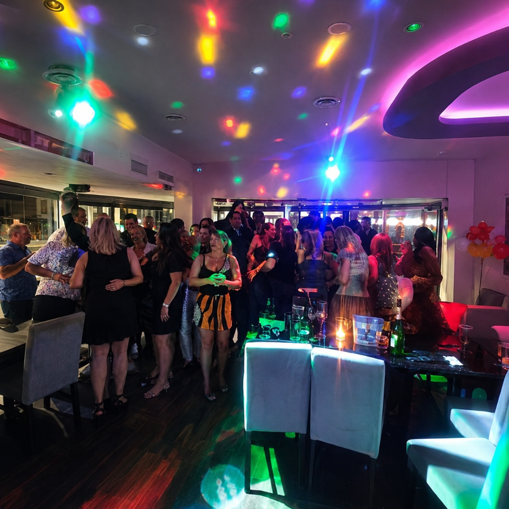 Guests enjoying a lively night with party lighting at The Posh Public House