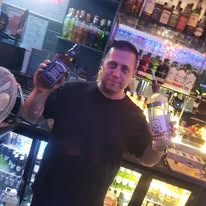 Bar staff behind the bar at The Posh Public House