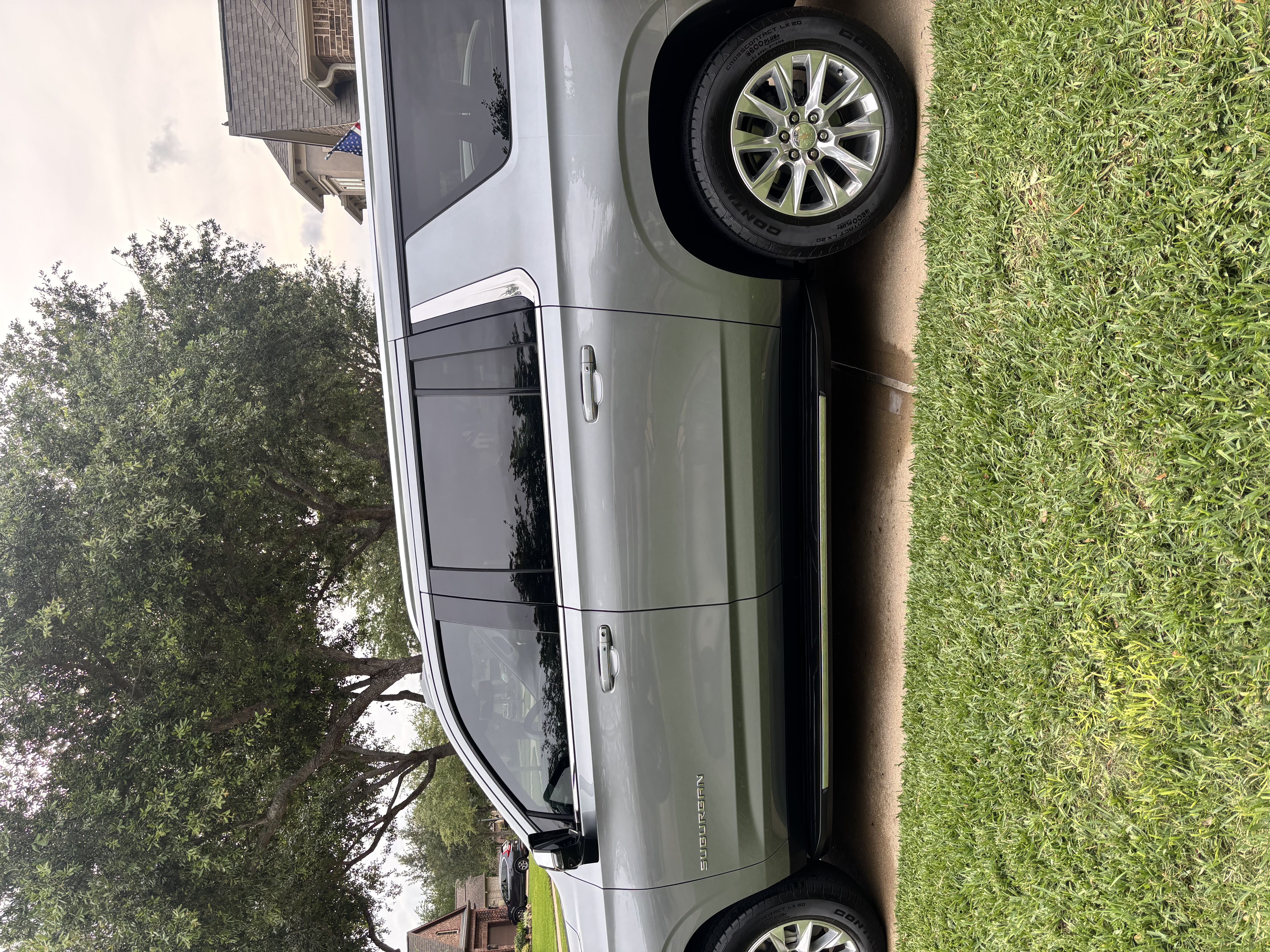 Silver Chevrolet Suburban side profile