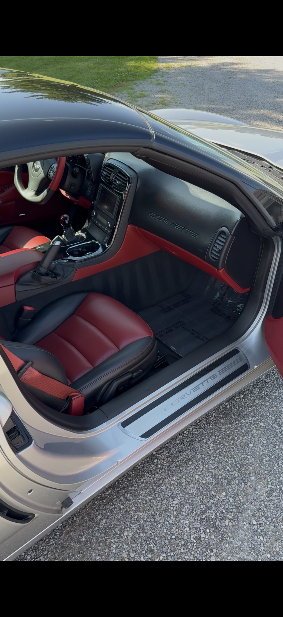 Red and black Corvette interior after professional interior detailing by S&B Auto Detailing