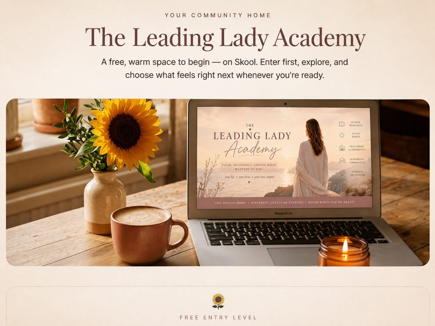 The Leading Lady Academy on a laptop with a sunflower, coffee and candle
