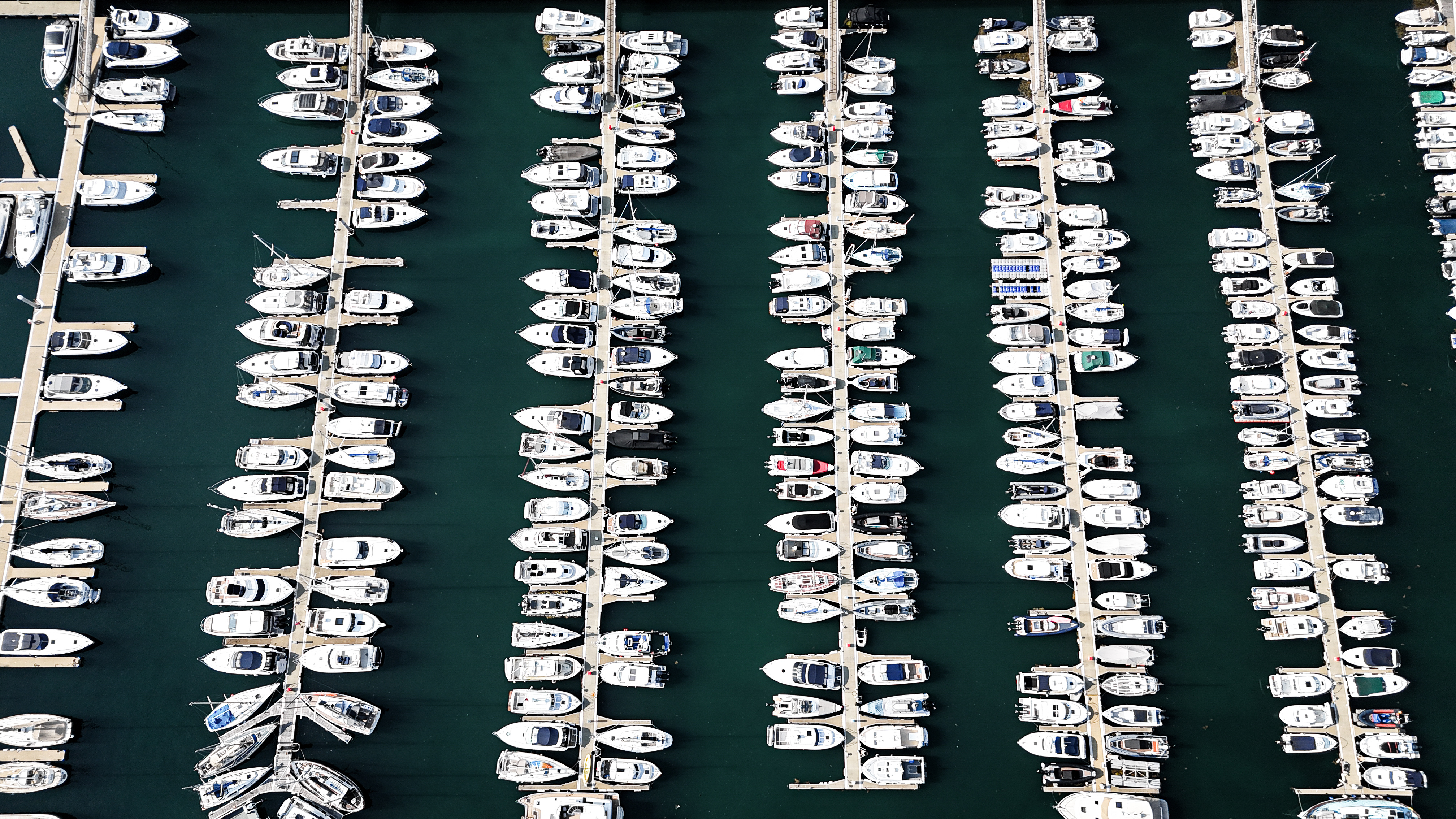 Marina full of moored boats photographed from directly above
