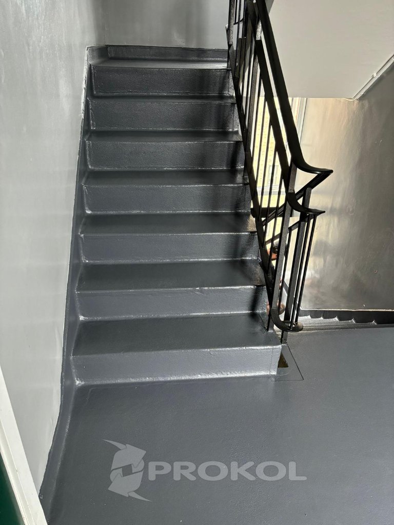 Interior courtyard waterproofing — grey membrane applied to floor and upstands, small-area application