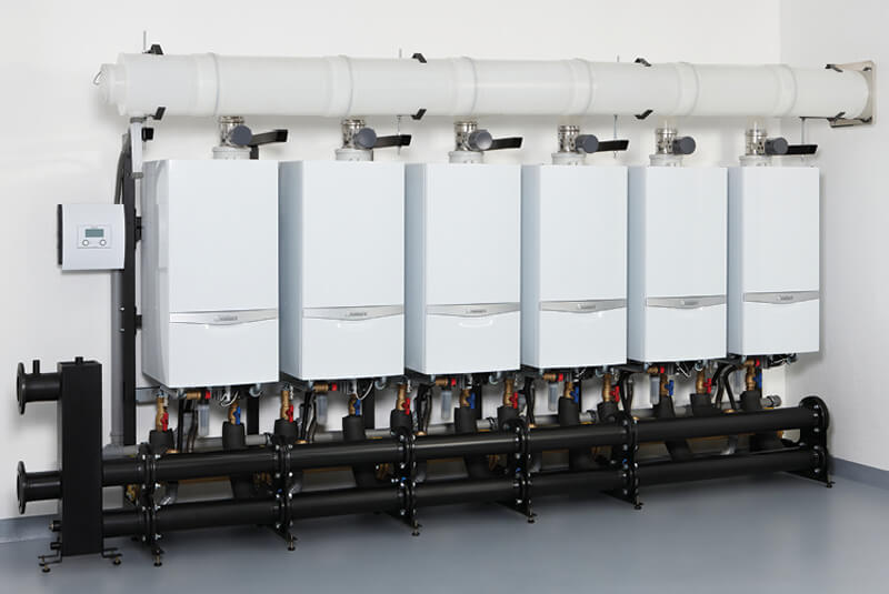 RARE Plumbing London commercial heating engineer working on a commercial boiler system in London