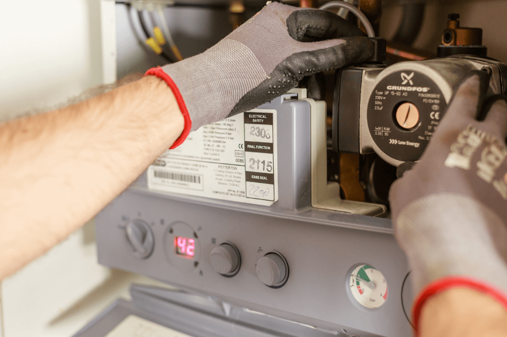RARE Plumbing London Gas Safe engineer repairing a boiler in a luxury London home