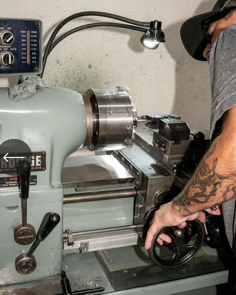 Machinist operating precision lathe