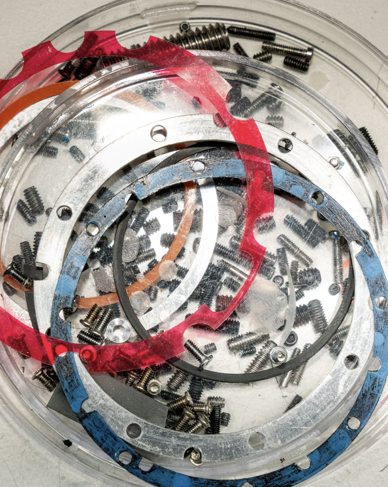 Lens hardware components in bowl