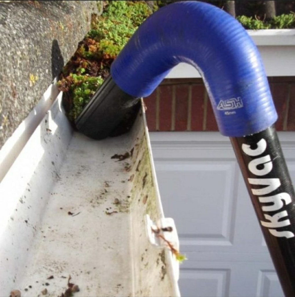 SkyVac gutter vacuum equipment in action