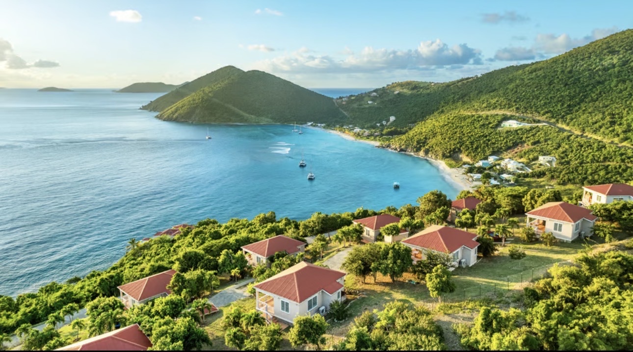 Villas set in green hills above a turquoise bay in the British Virgin Islands