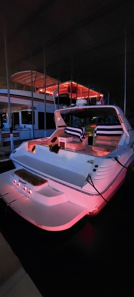 Yacht lit up at night at the dock