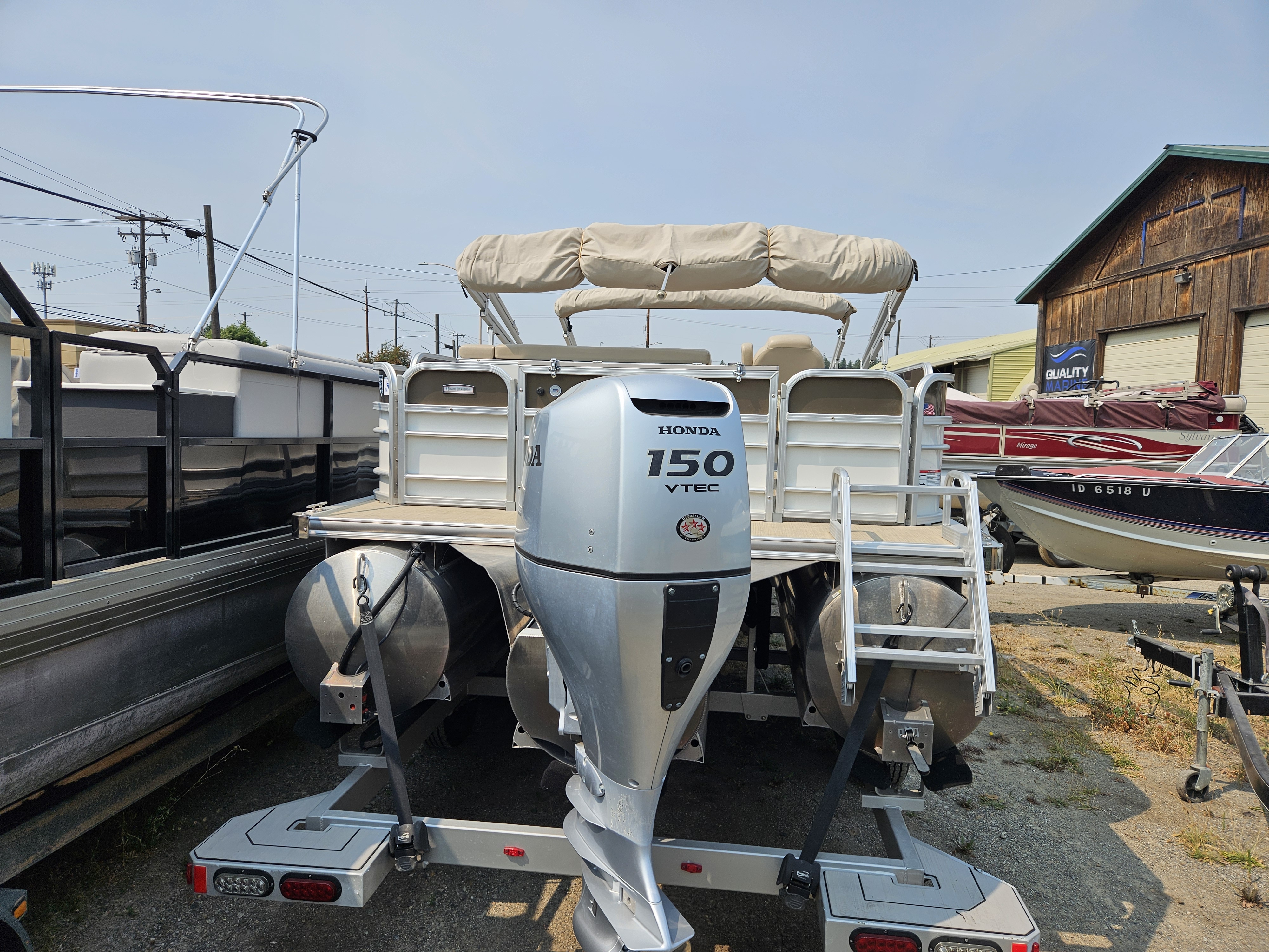 Rear view of Berkshire pontoon showing the 150HP Honda outboard motor