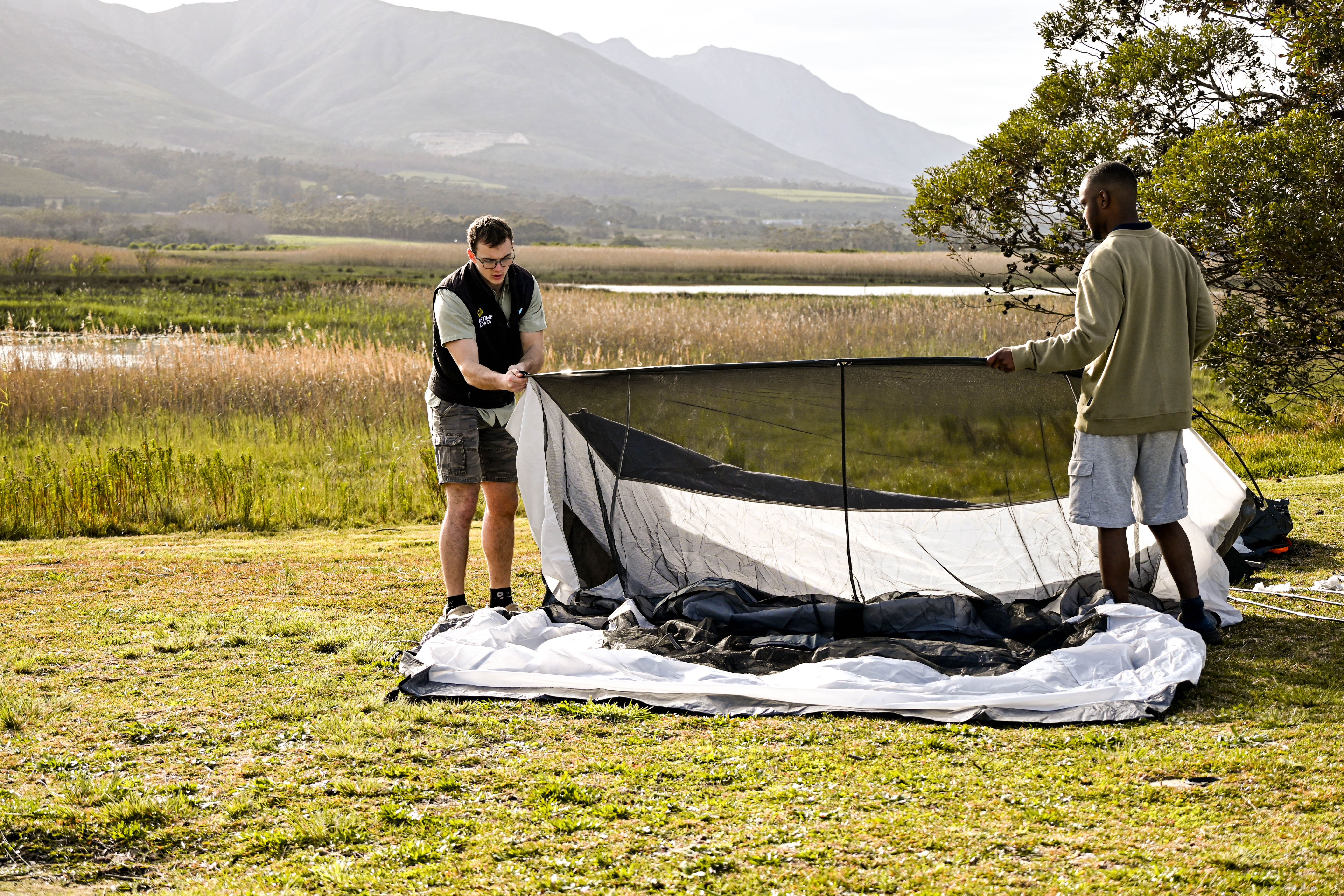 Pitching a tent with friends