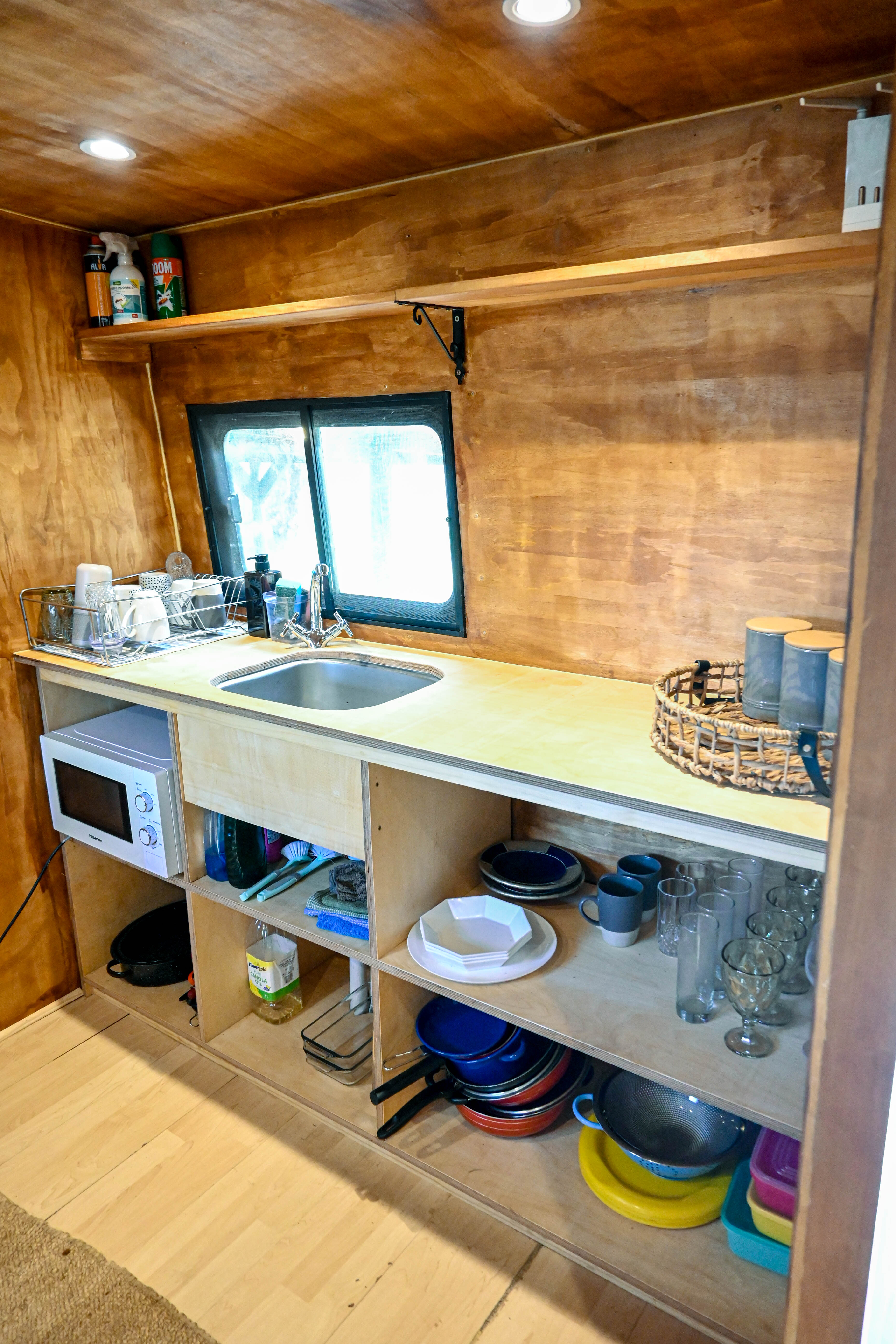 Bus kitchenette sink and shelves