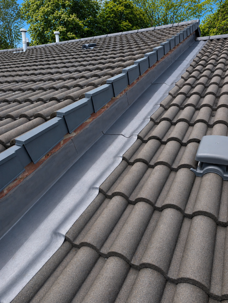 Completed flashing and verge remediation works at Montana House South Croydon — new lead flashings installed following independent surveyor diagnosis