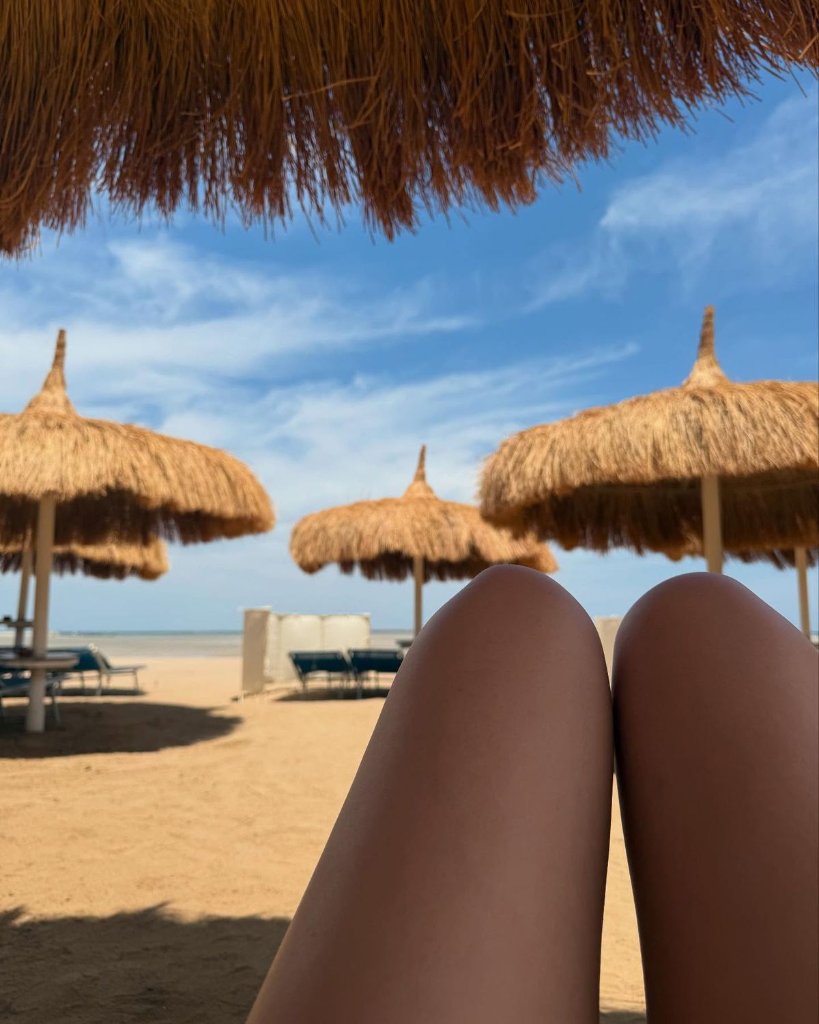 Beach umbrellas and sun beds by the Red Sea