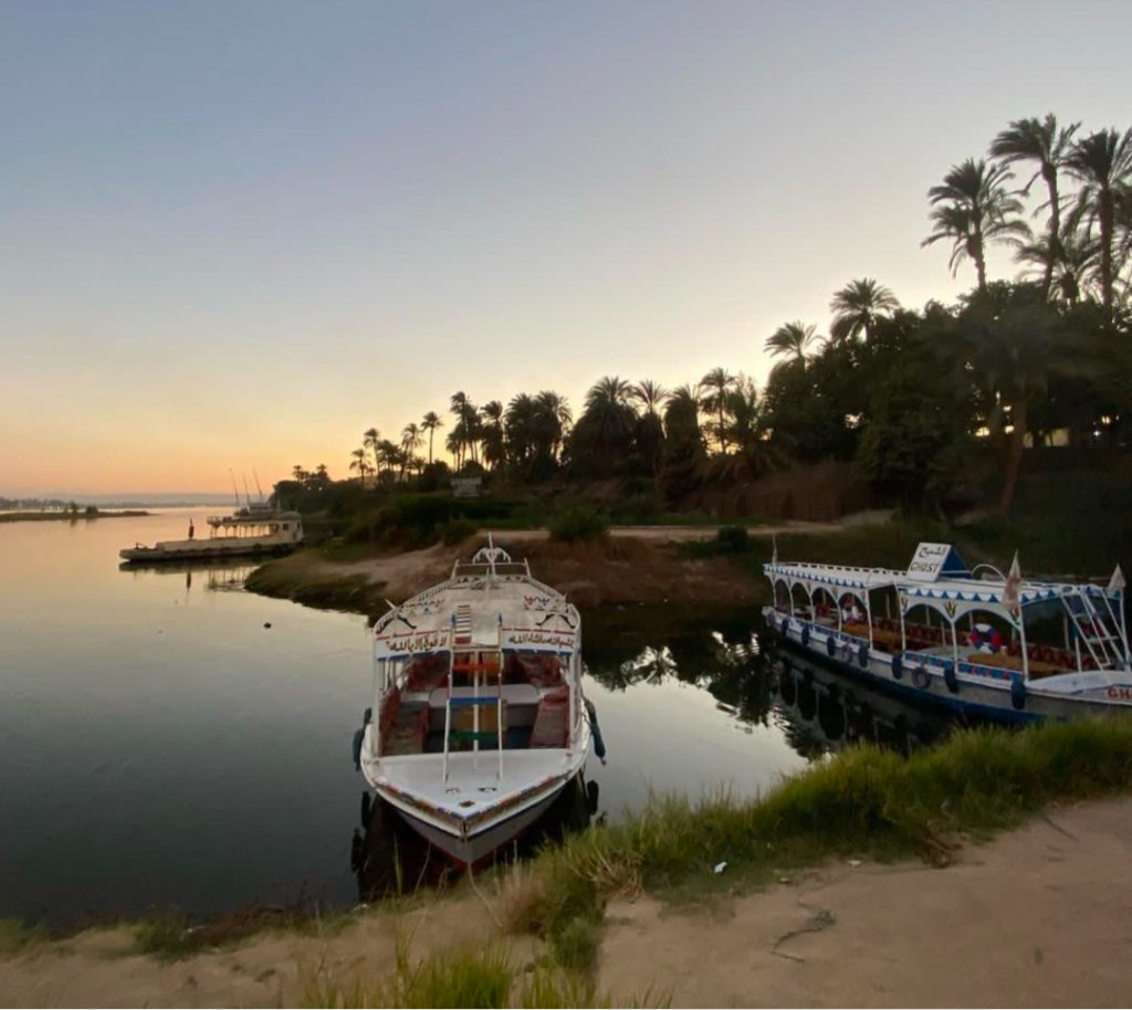 Nile sunset with traditional Egyptian feluccas