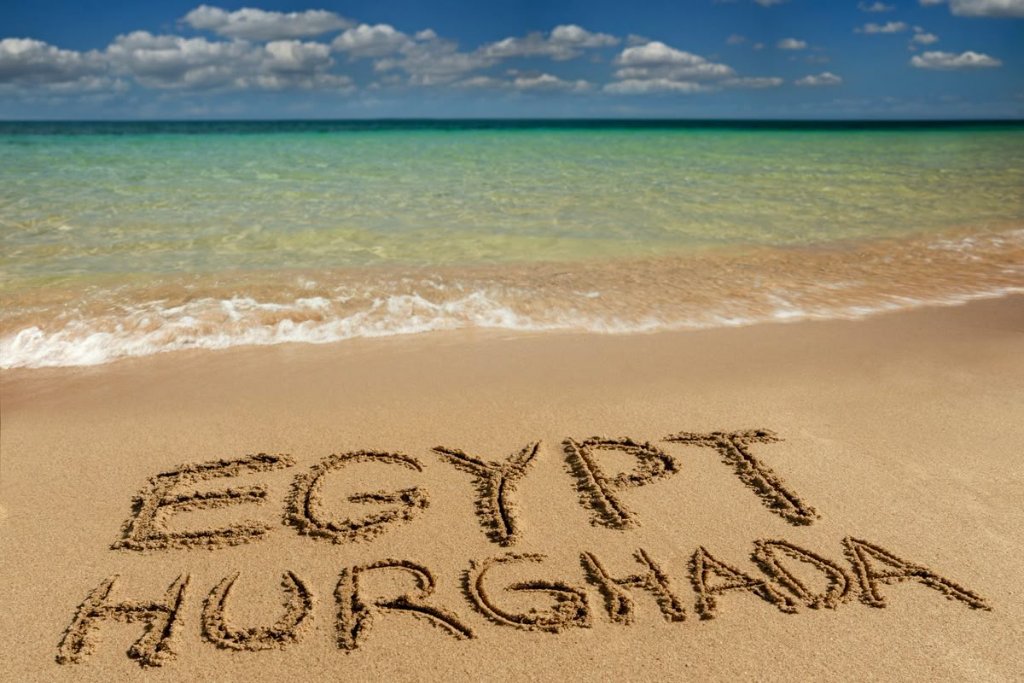 Egypt Hurghada written in the sand on the Red Sea beach