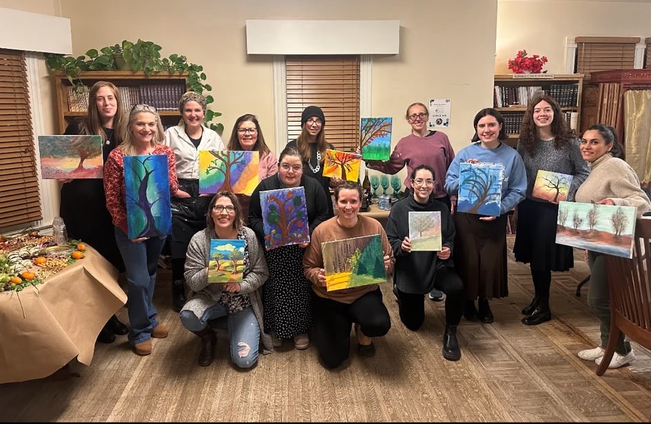 Community members at a painting event