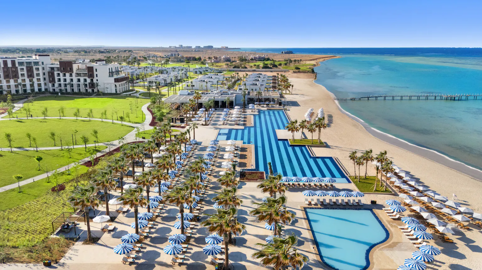 Aerial view of Rixos Murjana resort, pools and Red Sea beachfront