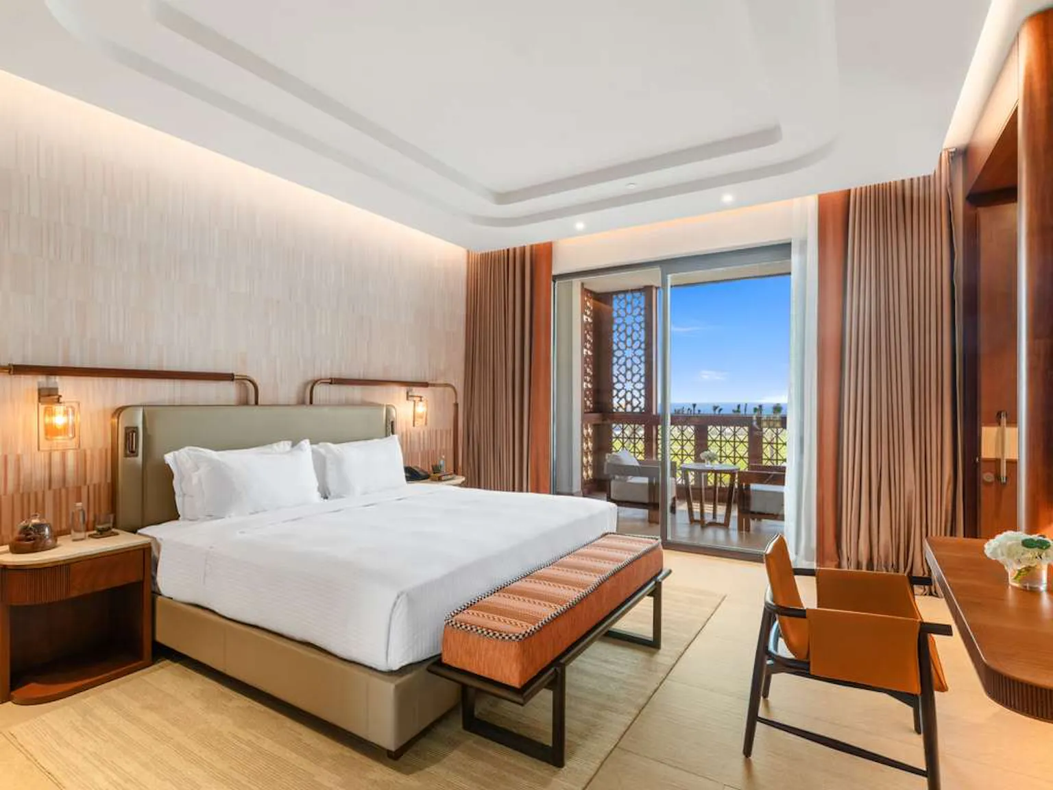 Rixos Murjana guest room with balcony and sea view