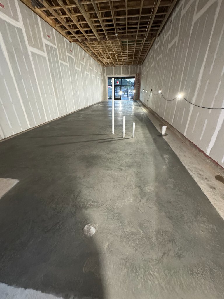 Commercial concrete floor slab with bollards