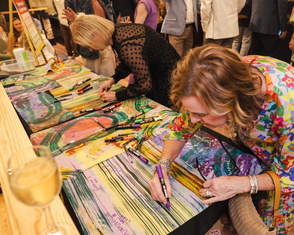 Art vs. Food — guests collaborating on a group art piece