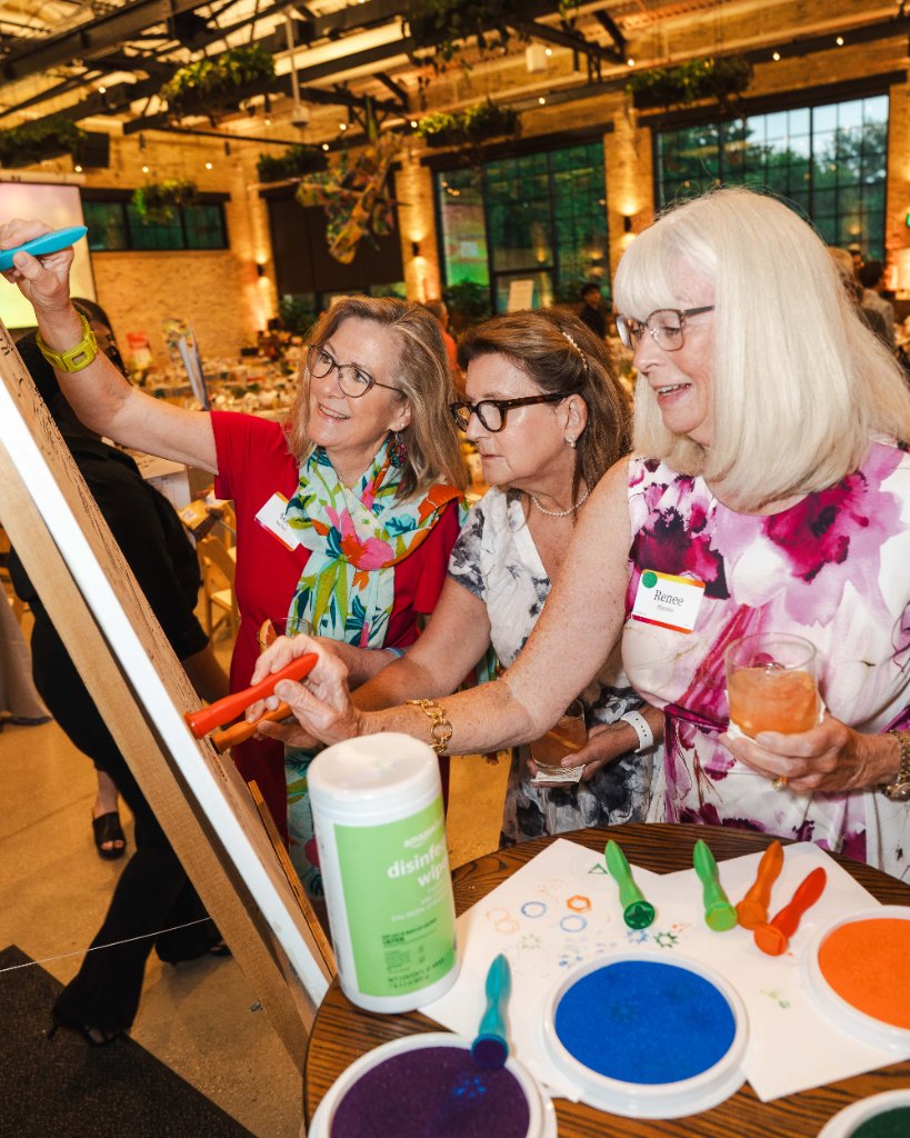 Art vs. Food — guests painting at an easel