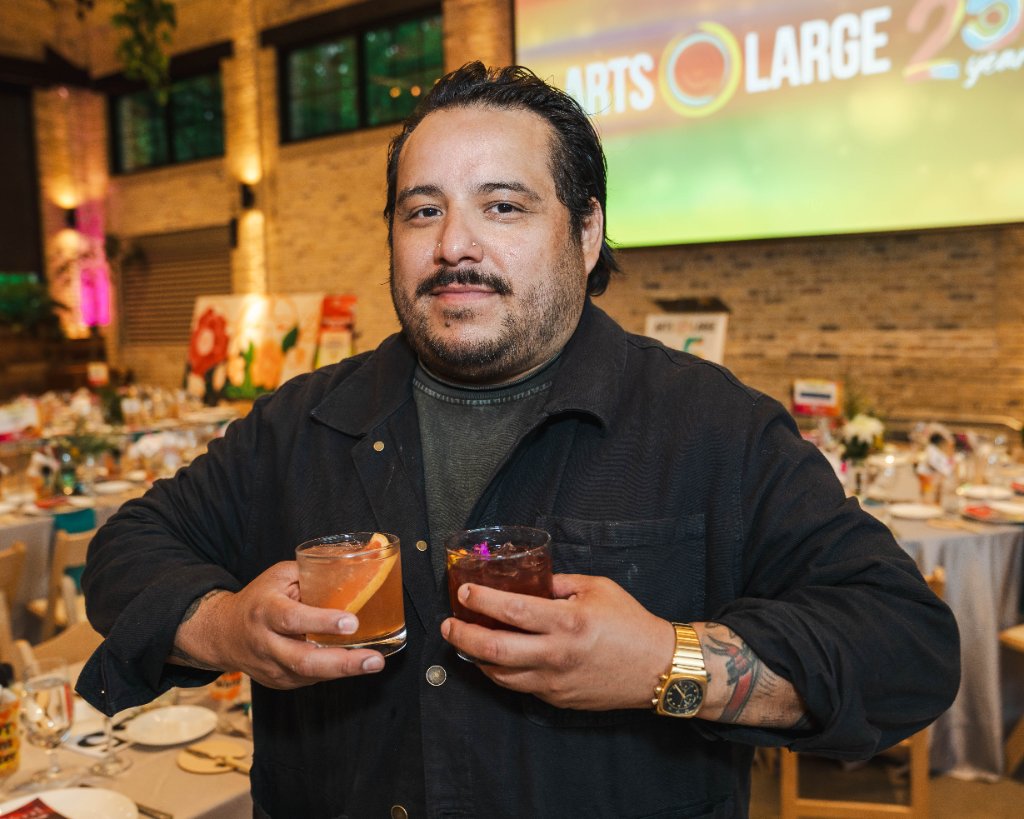 Art vs. Food — bartender holding two colorful cocktails