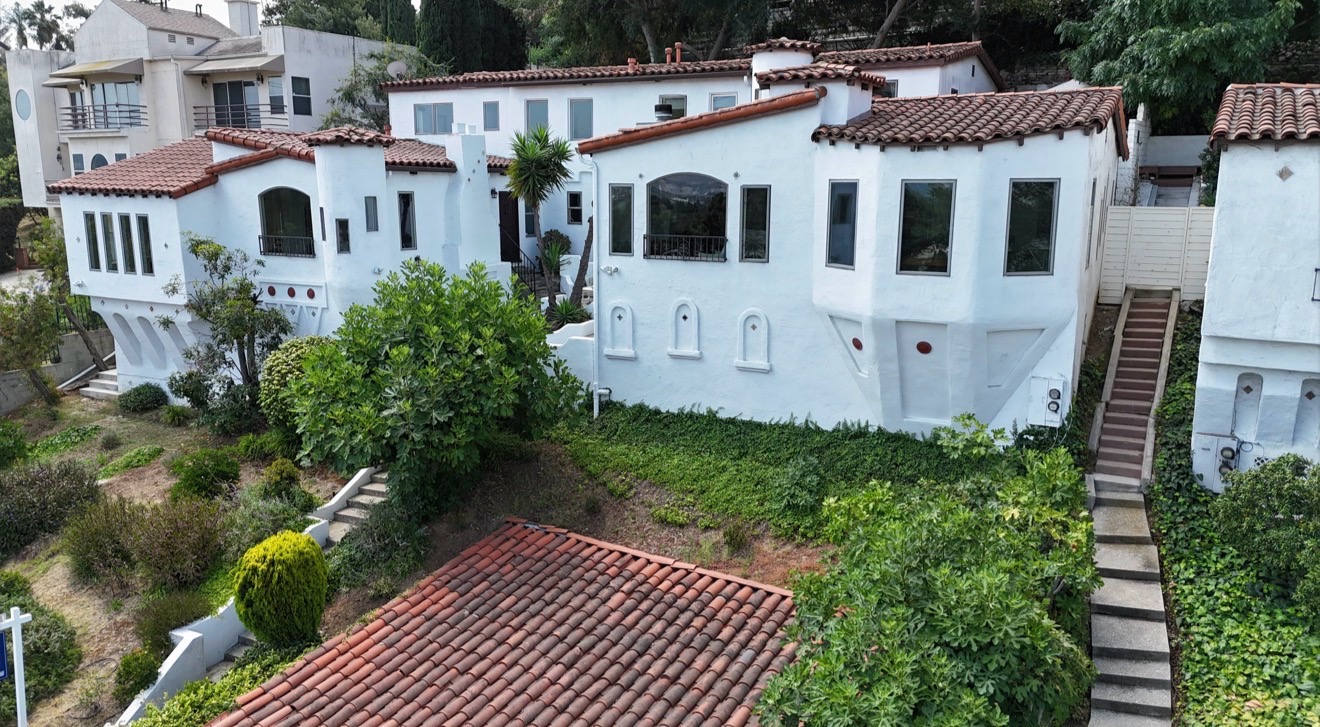 Multi-unit Spanish-Mediterranean property with clay tile roofs