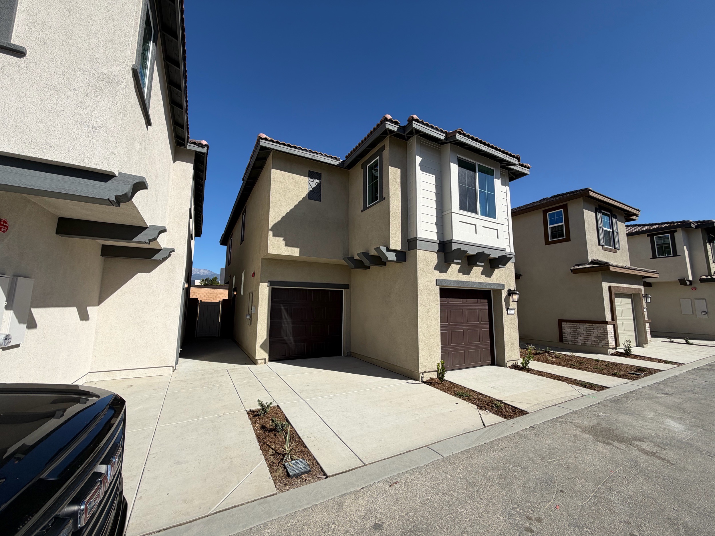 Contemporary two-car garage home with bay window