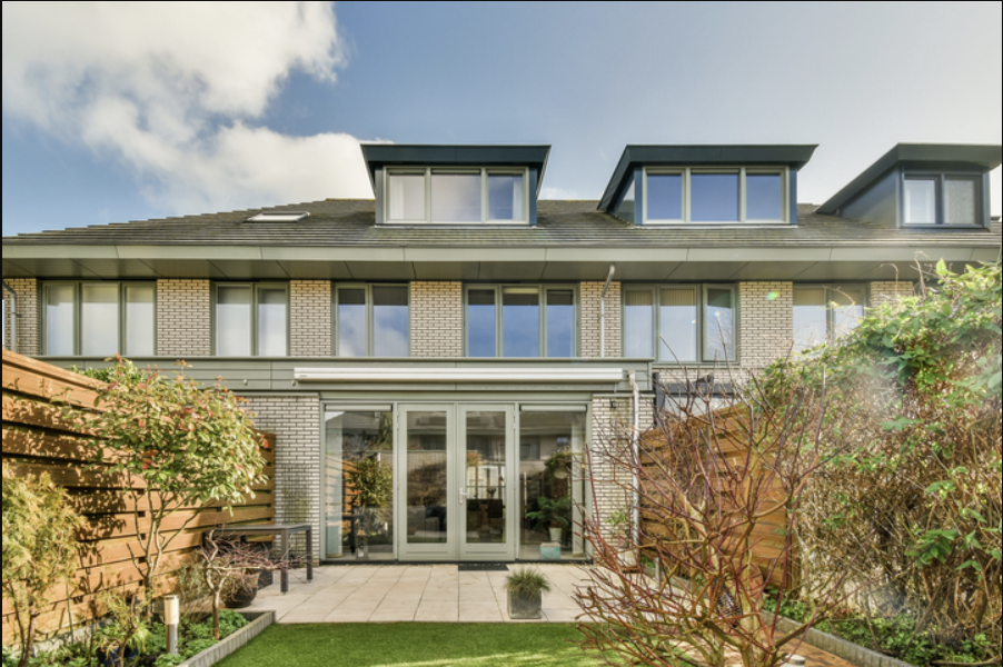 Rear exterior and patio of an inspected three-story townhome