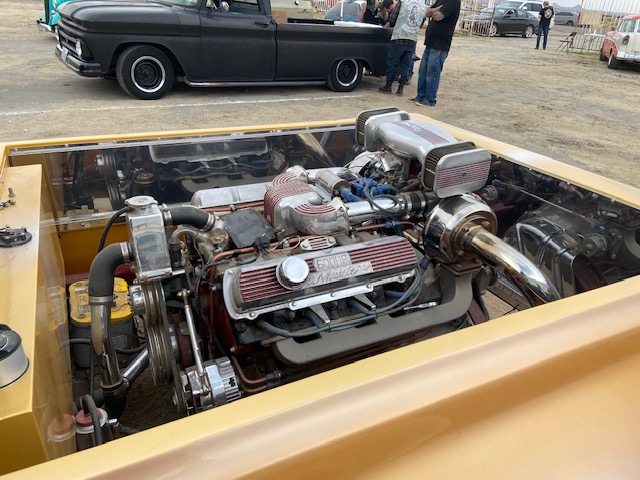 "Strip Star" — orange streamliner, back hatch open, Pomona lot