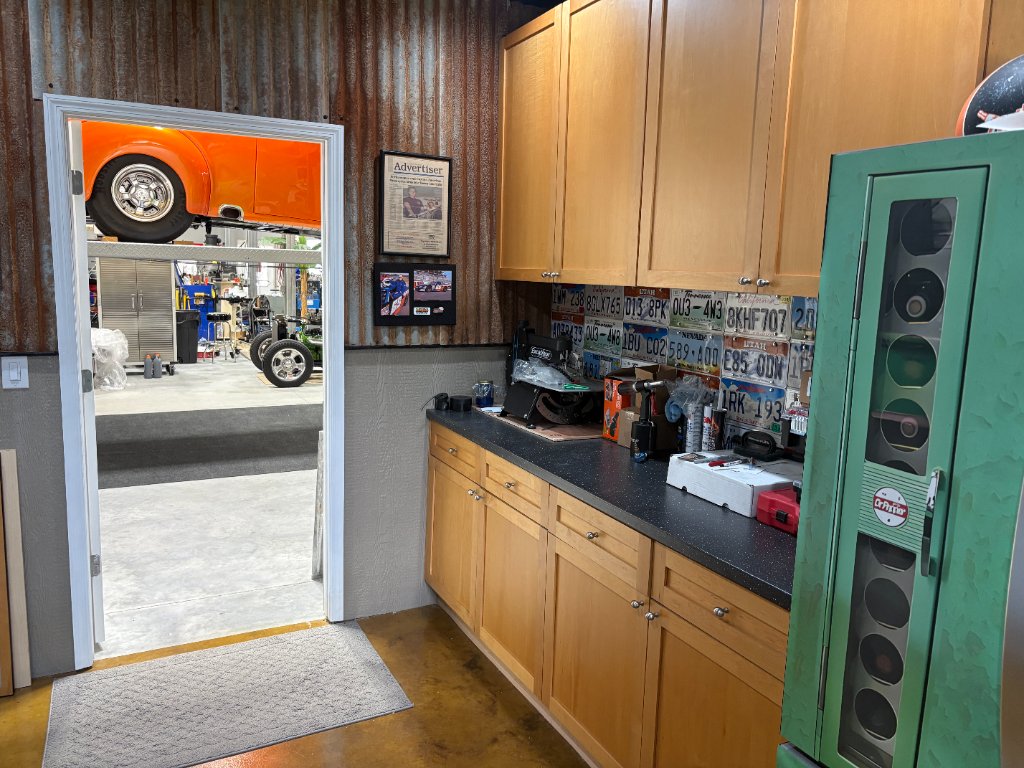 Bead rolling room — So-Cal Speed Shop sign, Summit bead roller, corrugated walls