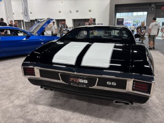 1970 SS Camaro — black with white stripes, SEMA indoor hall