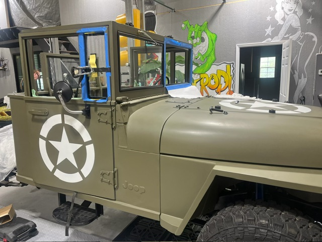 Three-quarter view — vent glass and side windows installed in shop