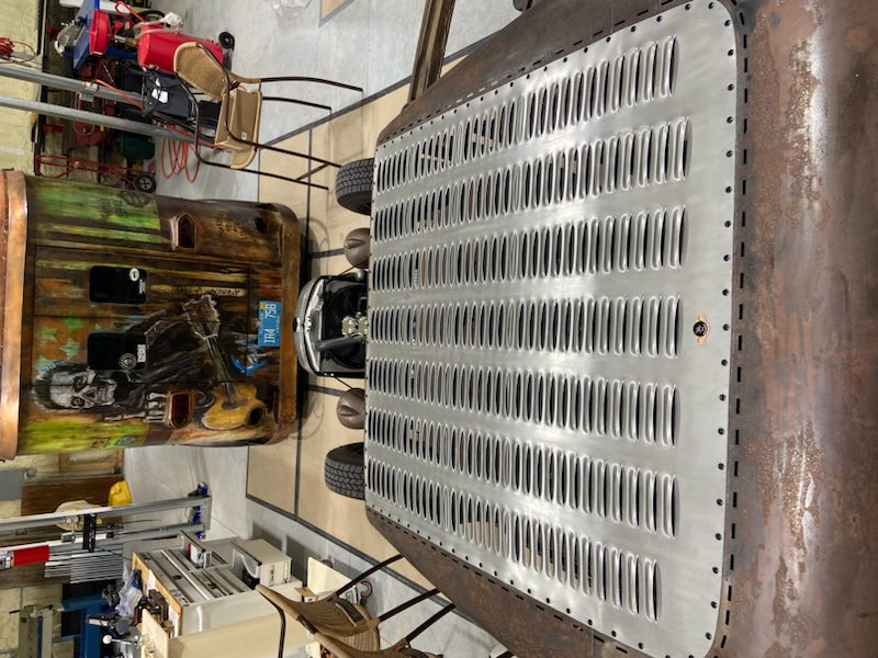 Completed interior — louvered top, bead-rolled door panel, custom dash