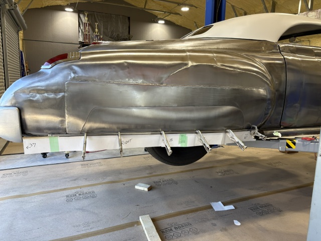 Side view on stands — extended lower quarters tacked into position