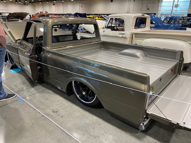 Gunmetal C10 — bagged stance, open tailgate, Classic Truck show