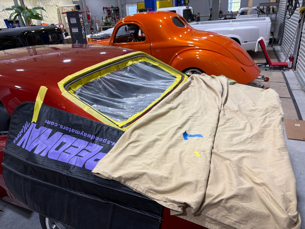 Rear deck lid glass — adhesive set, gaps checked from every angle