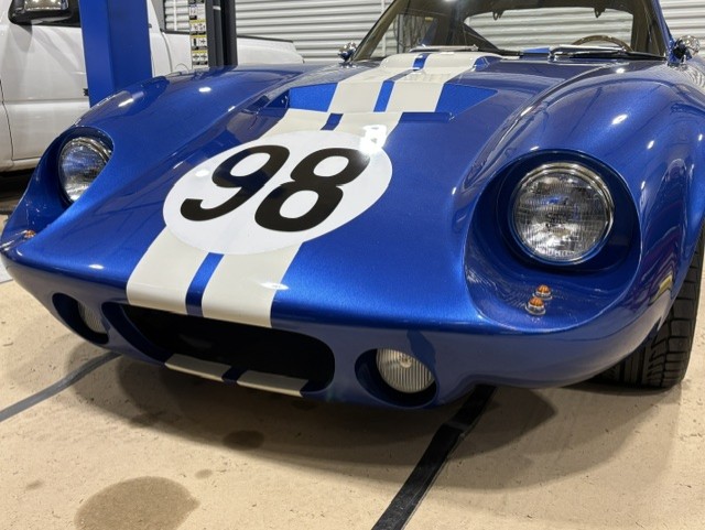 Front three-quarter — wide-mouth nose, period correct racing livery