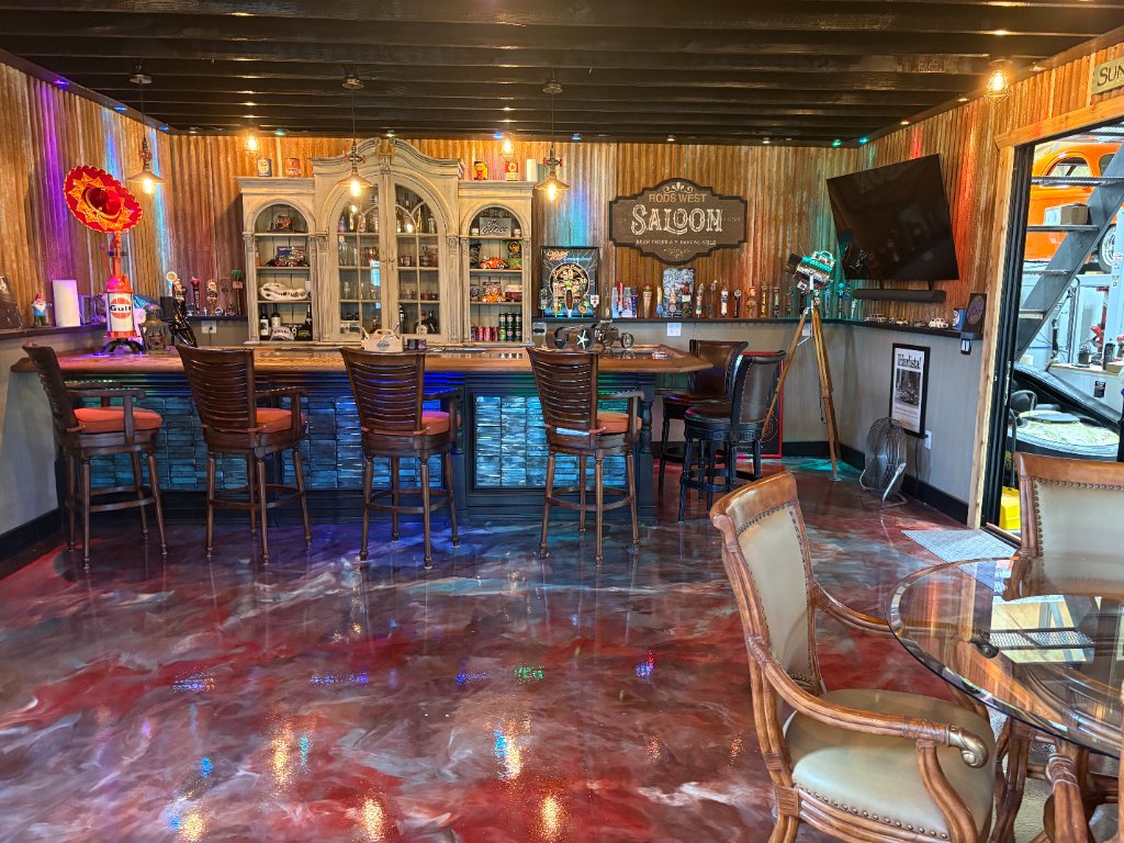 Rods West Saloon — full bar, tap handles, neon signs, Gulf memorabilia