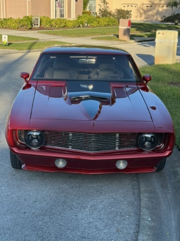 Front three-quarter — billet grille, LED headlights, hood scoop