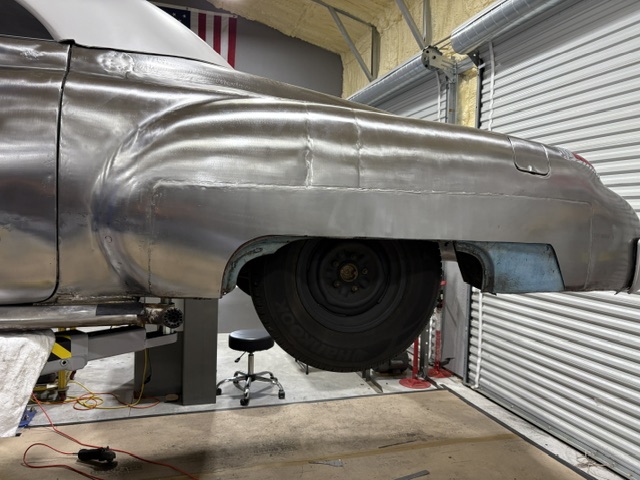 Driver's side — full lower quarter panel fitted and metal-finished