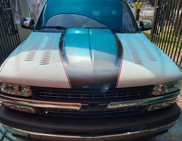After — custom louvered hood with teal-to-white fade and red racing stripe