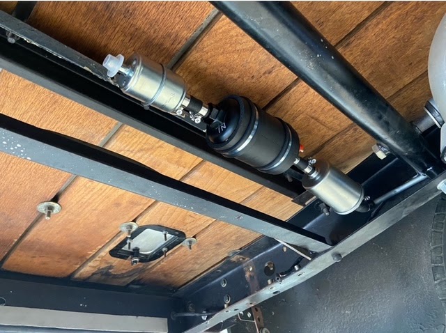 Fuel system plumbing — filter, regulator, and return line under bed