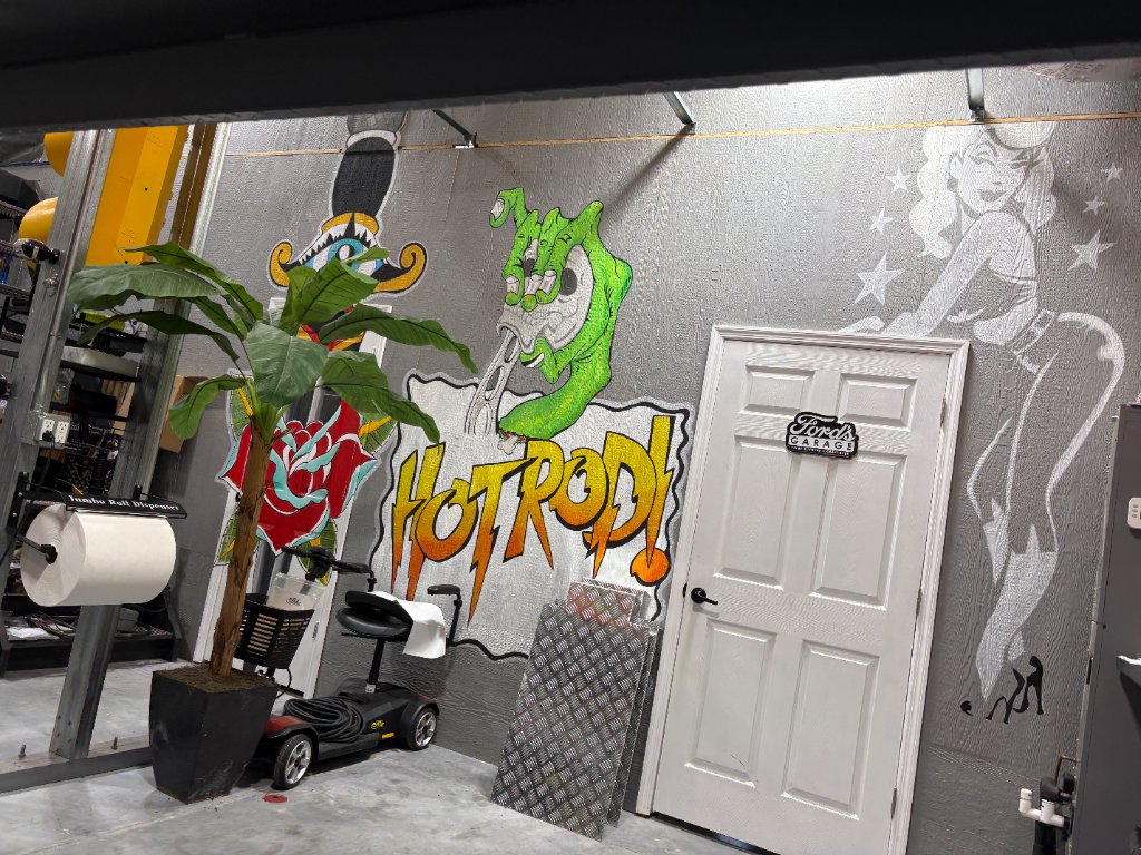 Shop mural — "Hot Rod!" lettering, Rat Fink, rose, pin-up, painted directly on the wall