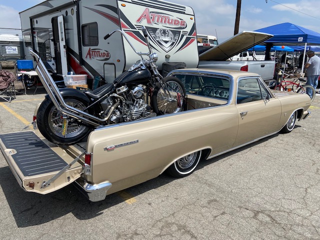Grand National Roadster Show grounds — rows of customs at dusk