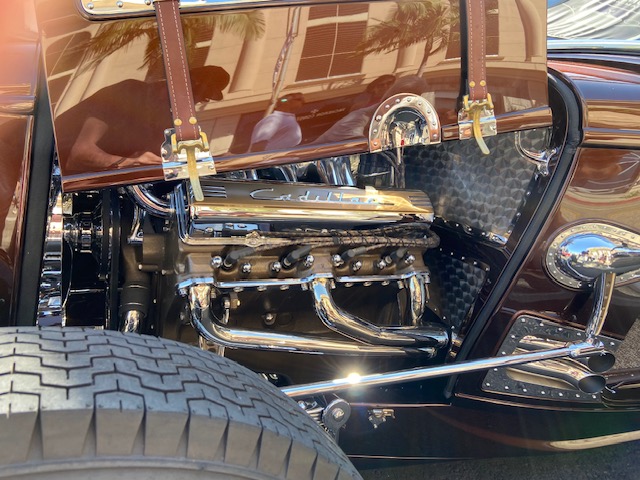 Hood ornament and body detail — copper pearl with chrome chain