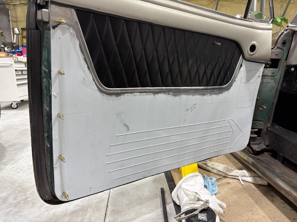Panel fitted to door — diamond-stitch upper insert mocked in, bead-rolled lower section