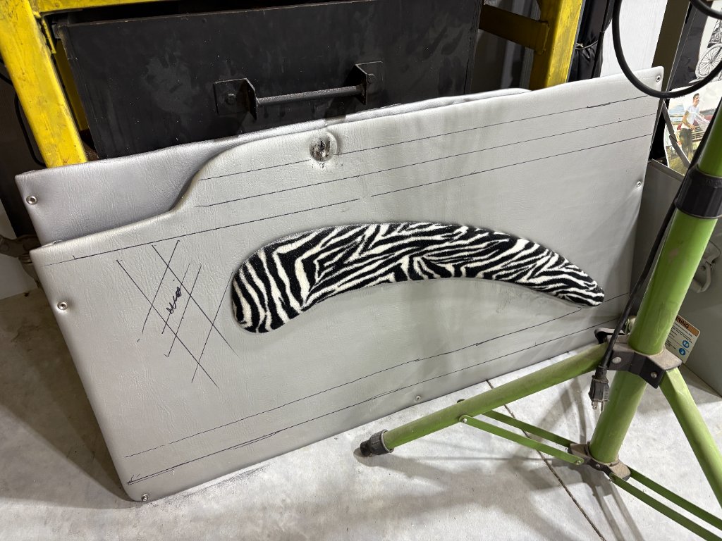 Door panel concept — silver vinyl with zebra-print armrest insert, early design phase